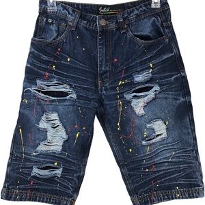 Switch Remarkable-paint splattered abstract distressed Jean shorts.